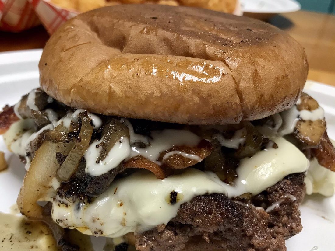 Loaded Mushroom and Swiss burger with bacon and sautéed onions