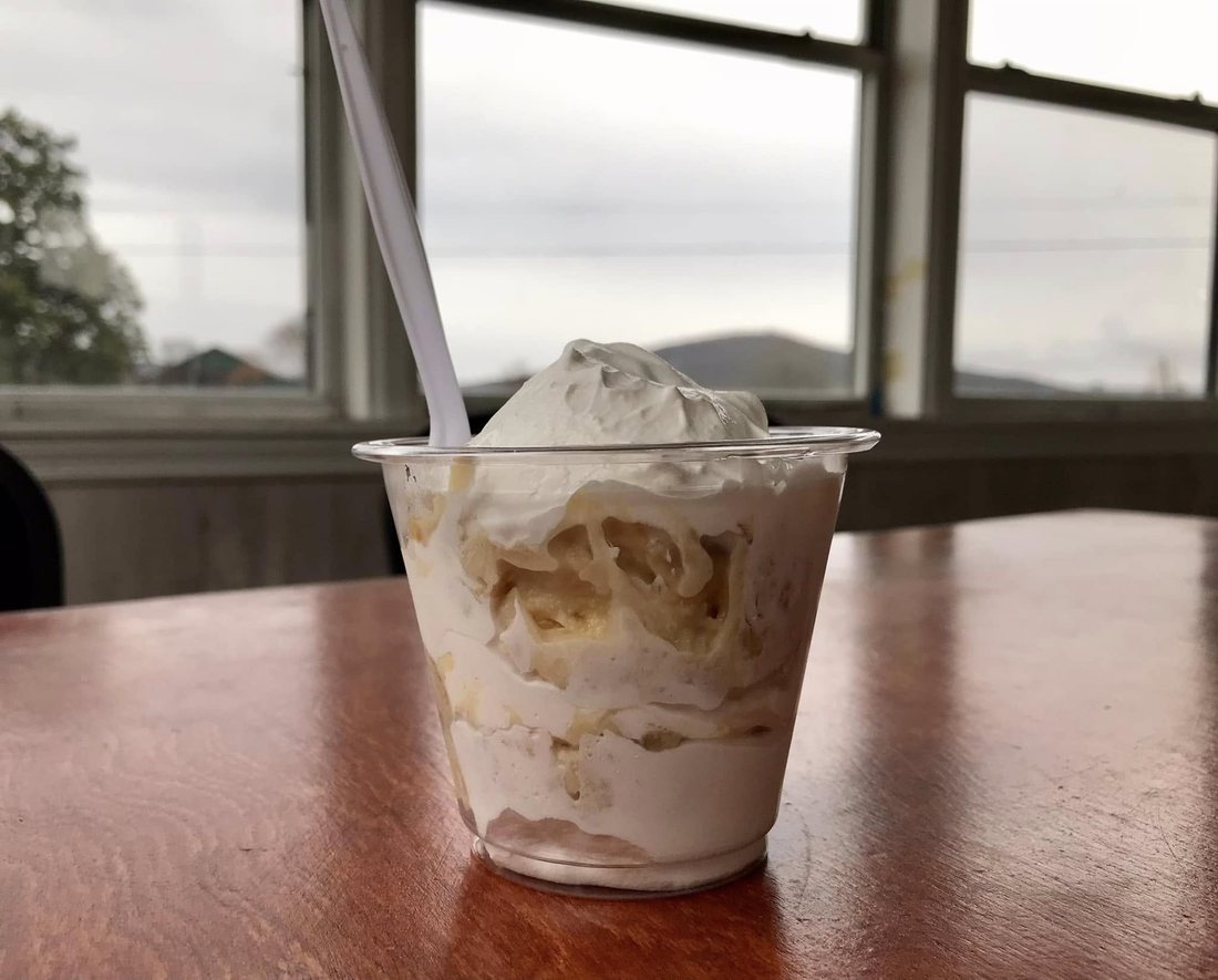 Moon Pie banana pudding in a cup with a window view behind it