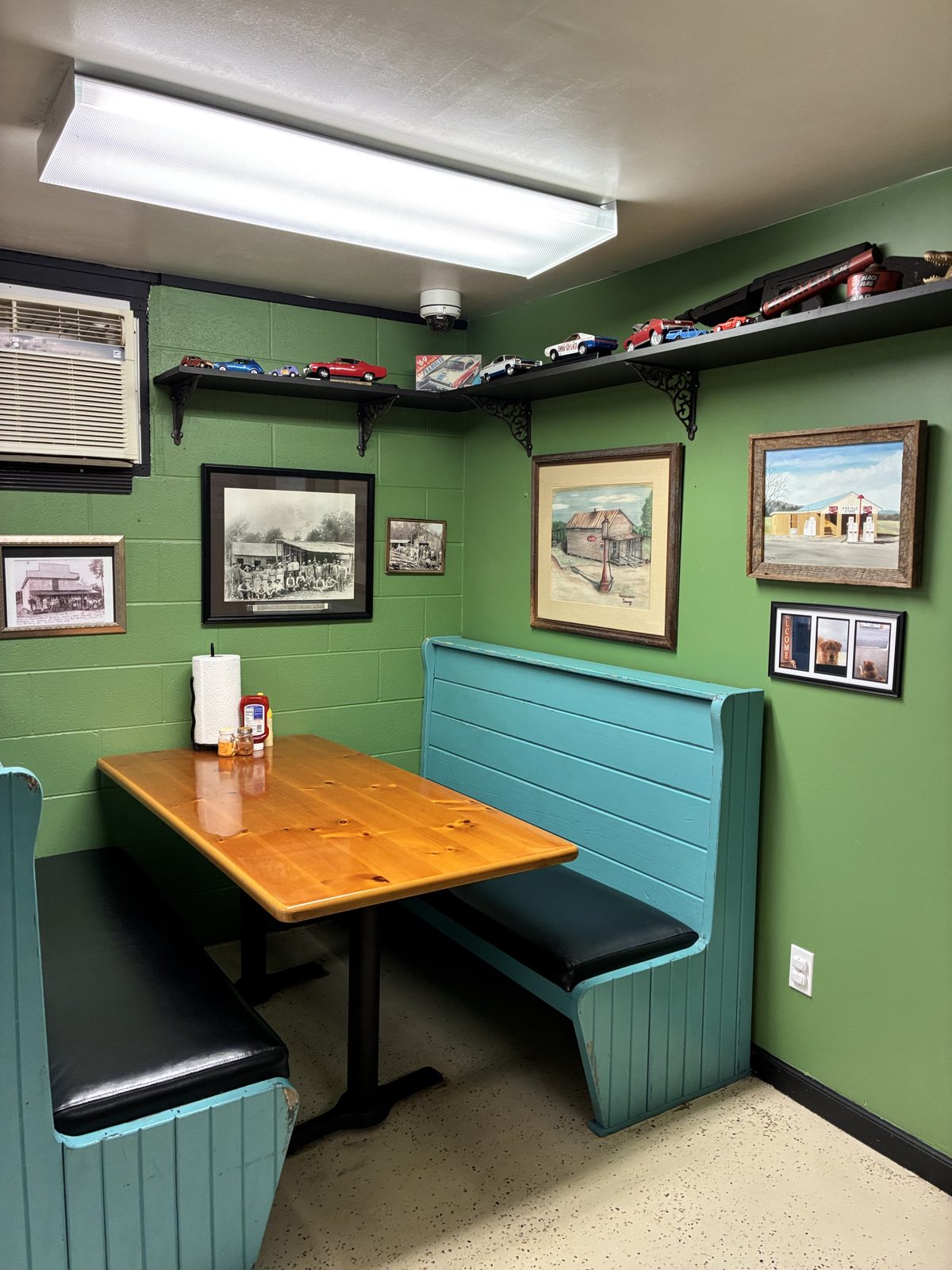 Corner booth with historic framed photographs on the wall